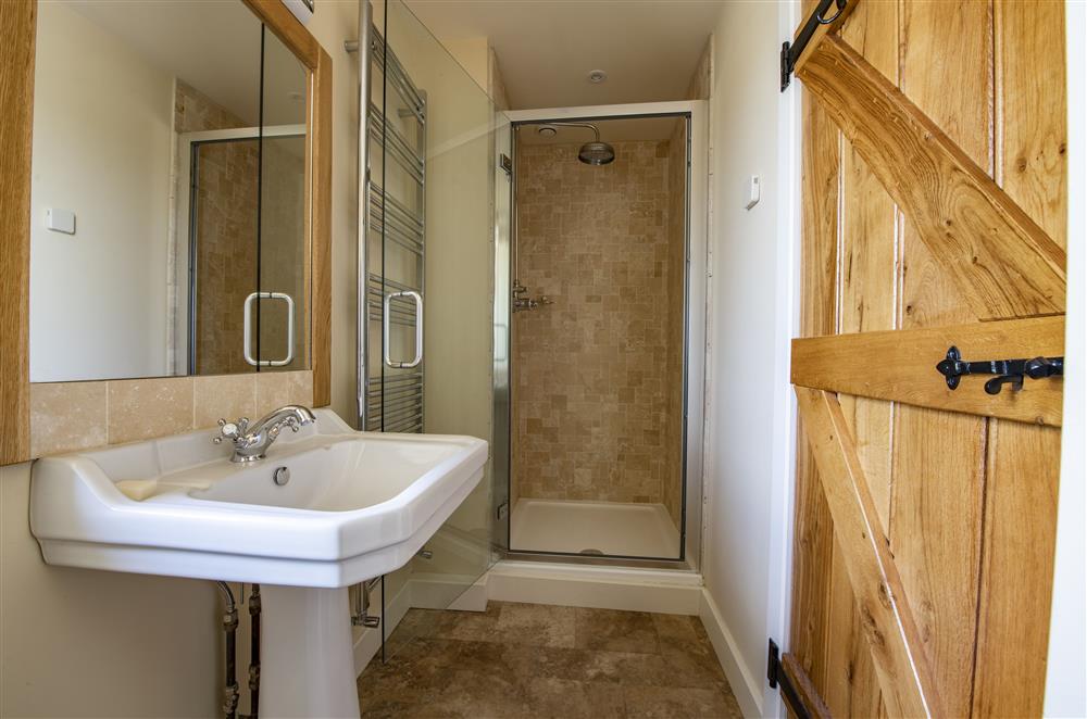 En-suite shower room with limestone travertine tiled shower at Todd Hills Hall Farmhouse and Vale Croft, Melmerby
