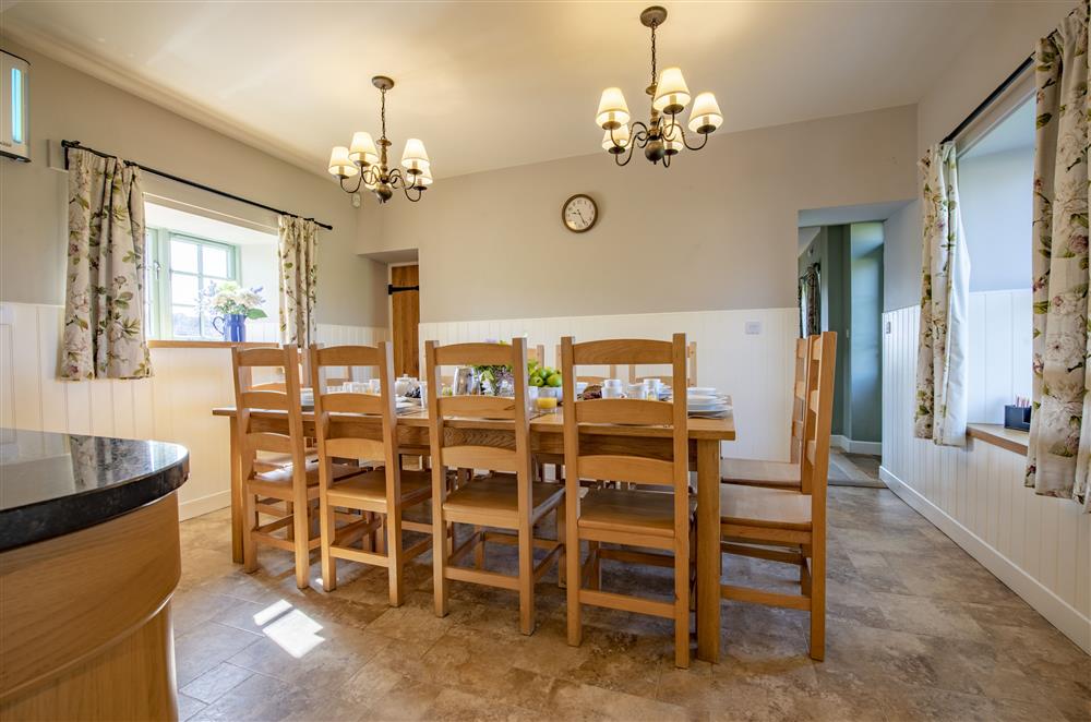 Enjoy a home cooked meal at the table seating ten guests in the welcoming kitchen at Todd Hills Hall Farmhouse and Vale Croft, Melmerby
