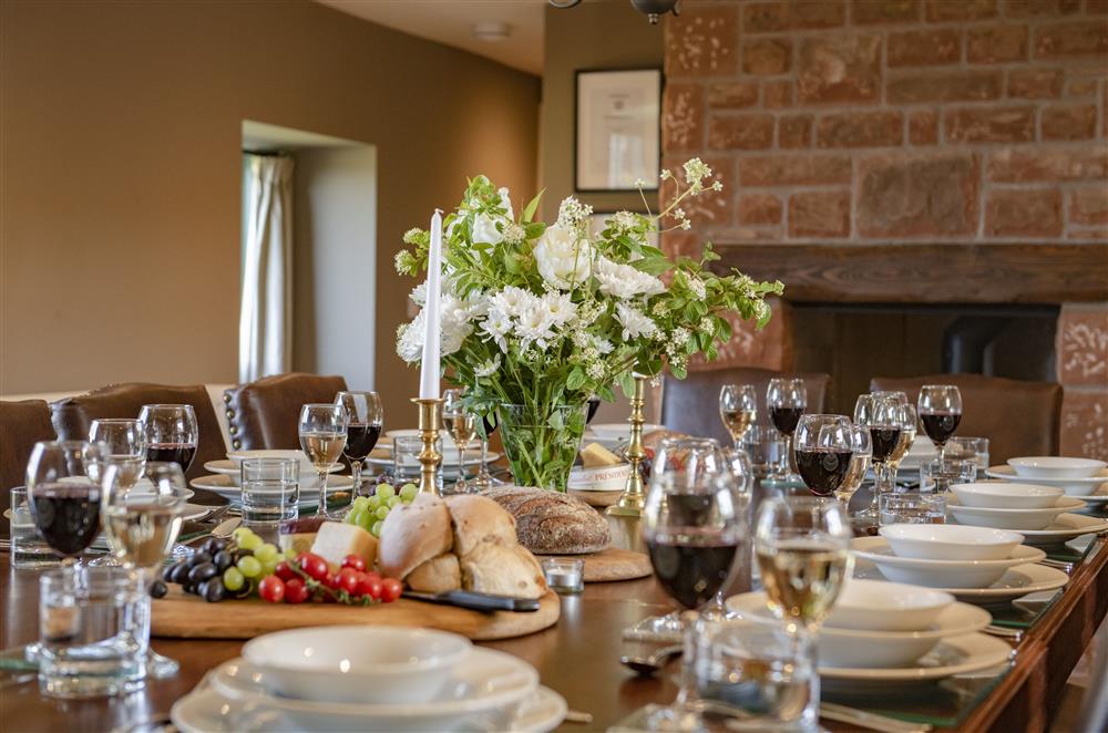 Enjoy gathering together in the dining room by the wood burning stove at Todd Hills Hall Farmhouse and Vale Croft, Melmerby
