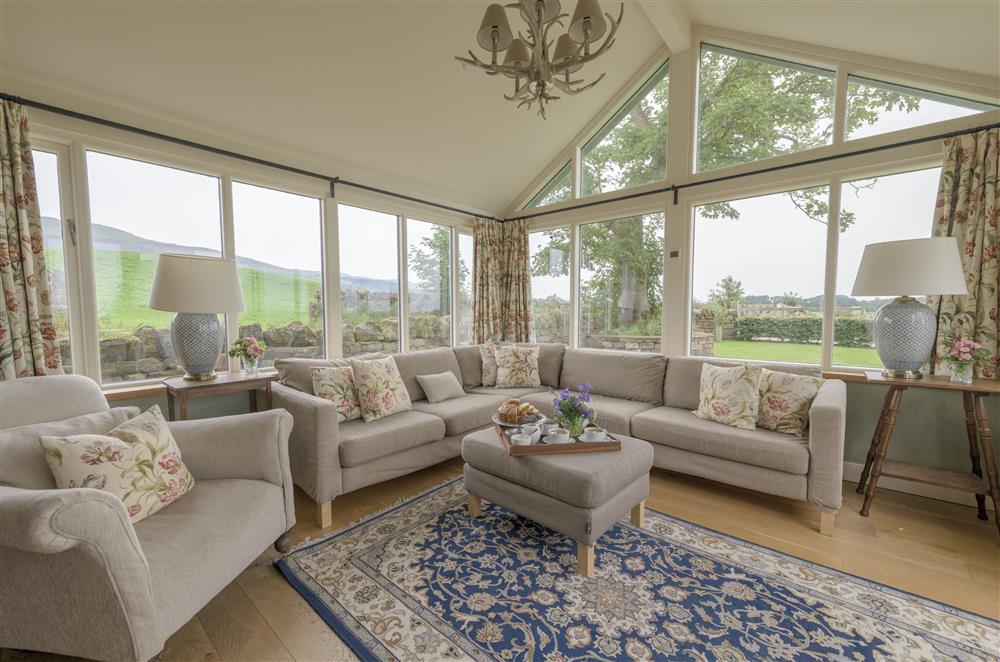 Enjoy the glorious view from the comfort of the day room at Todd Hills Hall Farmhouse and Vale Croft, Melmerby