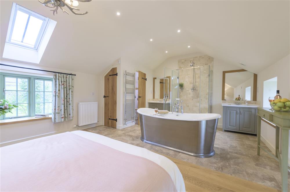 Free-standing cast iron bath, shower cubicle and separate wc in Bedroom four at Todd Hills Hall Farmhouse and Vale Croft, Melmerby