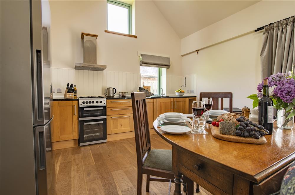 Light and airy open-plan kitchen, dining and sitting room at Todd Hills Hall Farmhouse and Vale Croft, Melmerby