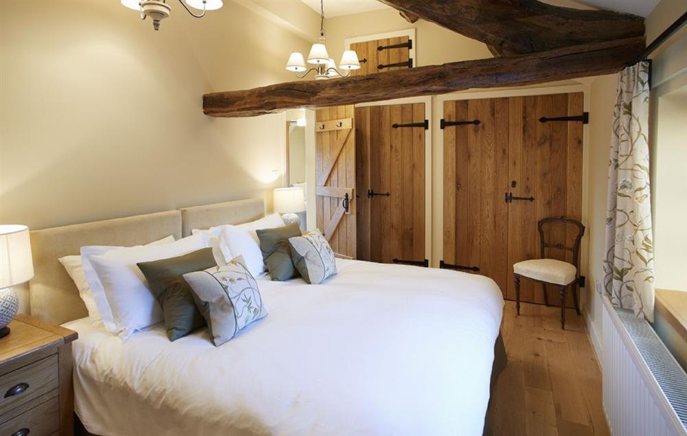 Bedroom 2 with 6’ zip and link double bed and en-suite shower room at Todd Hills Hall Farmhouse, Melmerby