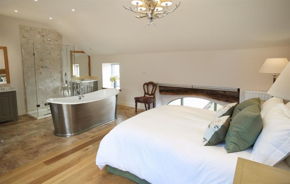 Bedroom 4 with 5’ king size bed and integrated en-suite bathroom at Todd Hills Hall Farmhouse, Melmerby