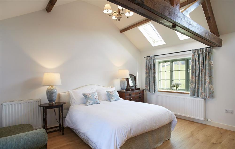 Bedroom 5 with 5’ king size bed and en suite shower. at Todd Hills Hall Farmhouse, Melmerby