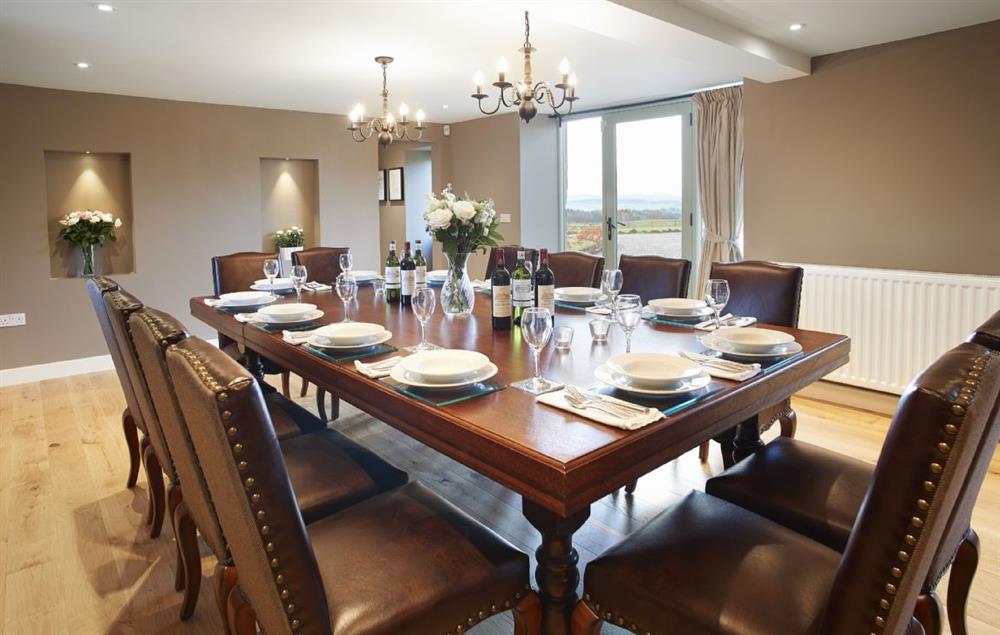 Dining room with table seating twelve guests at Todd Hills Hall Farmhouse, Melmerby