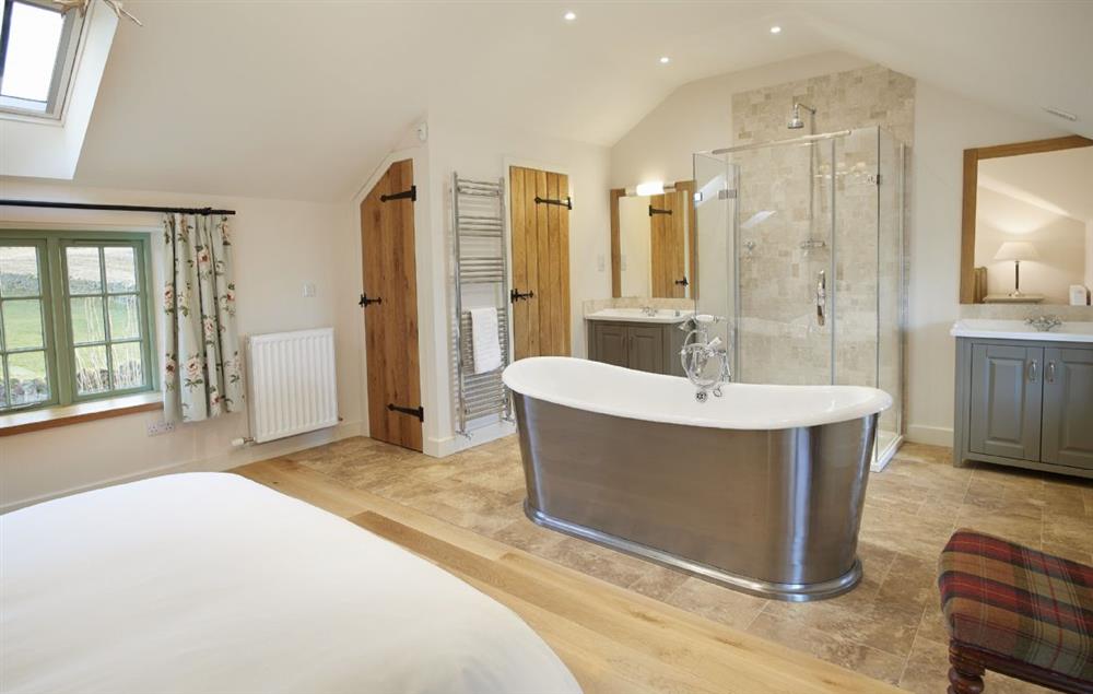 Free standing cast iron bath, shower cubicle and separate wc in Bedroom 4 at Todd Hills Hall Farmhouse, Melmerby