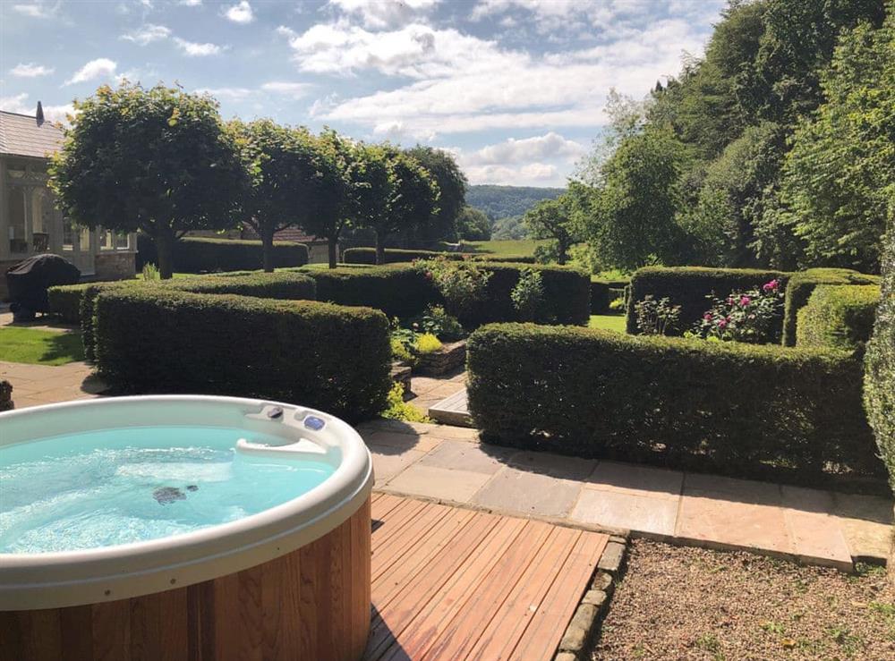 Luxurious hot tub within well-maintained garden at Todds Pasture in Hawnby, near Helmsley, North Yorkshire