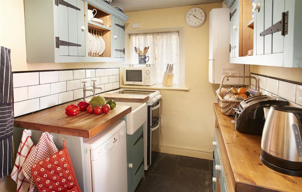 Compact galley kitchen at Toll House, Nether Stowey
