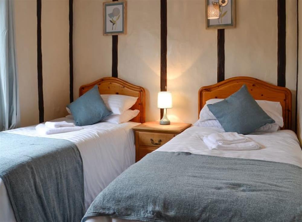 Twin bedroom at Tollgate Cottage in Blythburgh, near Southwold, Warwickshire