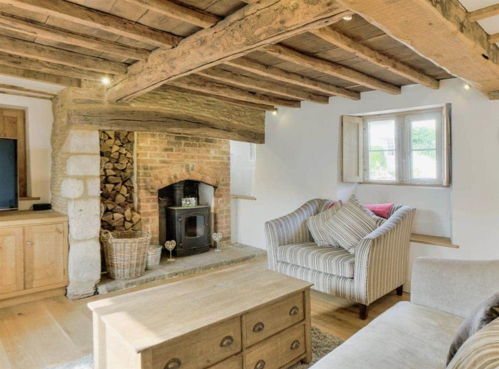 Beautiful living room with plenty of character and beamed ceilings at Tom Cottage in Wing, near Oakham, Leicestershire
