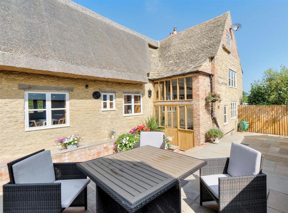 Large patio area at Tom Cottage in Wing, near Oakham, Leicestershire