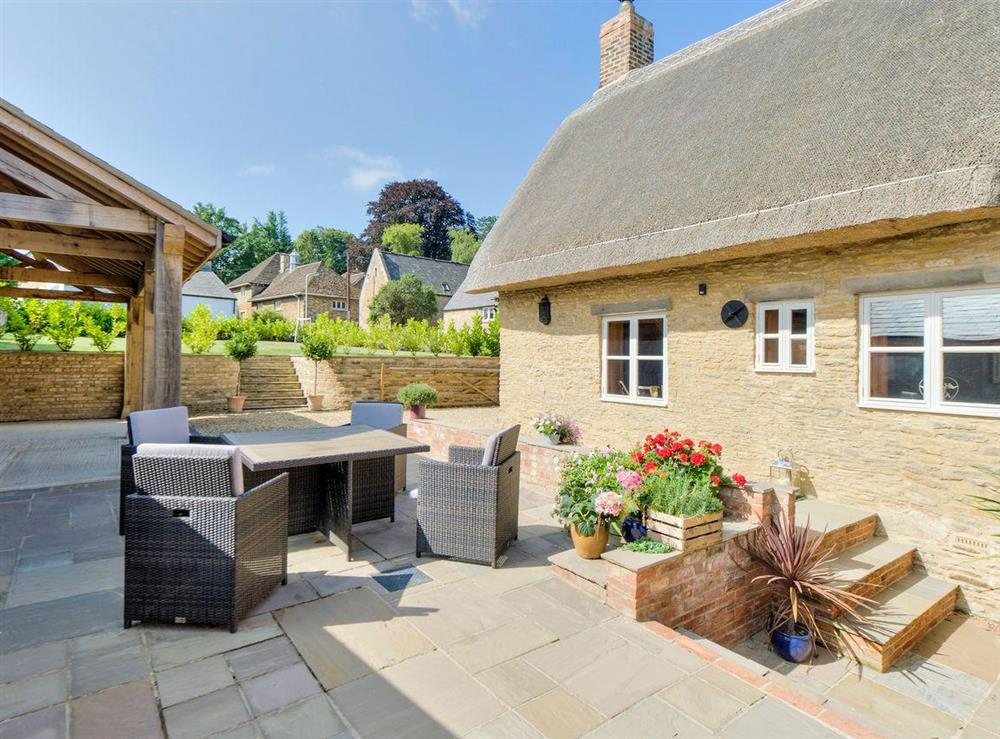 Patio, ideal for alfresco dining at Tom Cottage in Wing, near Oakham, Leicestershire