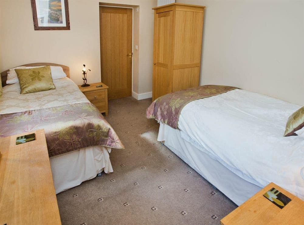 Good-sized twin bedroom at Tommys Cottage in Keswick, Cumbria