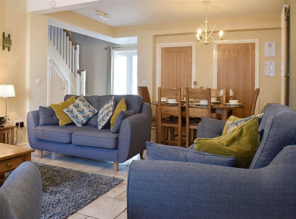 Lounge area and living and dining room at Tommys Cottage in Keswick, Cumbria