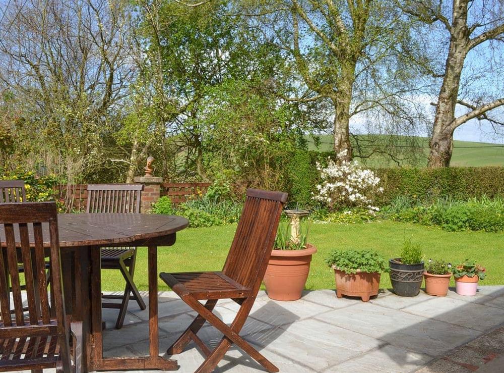 Enclosed courtyard garden with garden furniture at Toms Cottage in Dalton-in-Furness, Cumbria