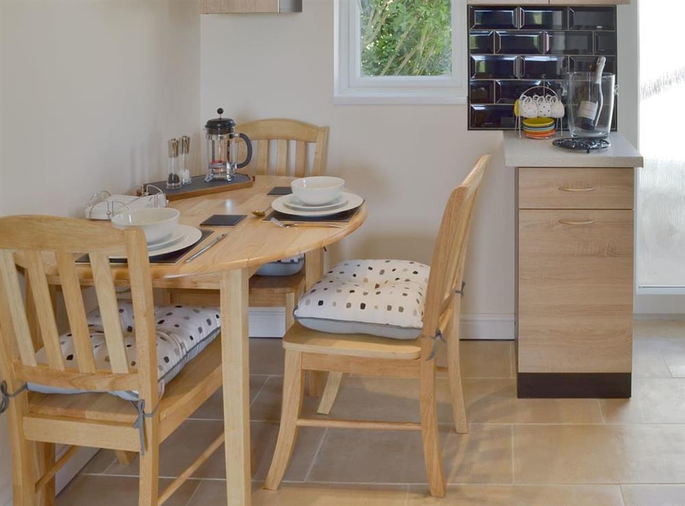 Quaint dining area at Tontos View in Sorley Green Cross, near Kingsbridge, Devon
