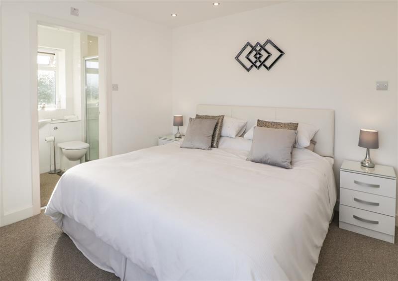 A bedroom in Top Of The Lane Holiday Apartment at Top Of The Lane Holiday Apartment, Benllech