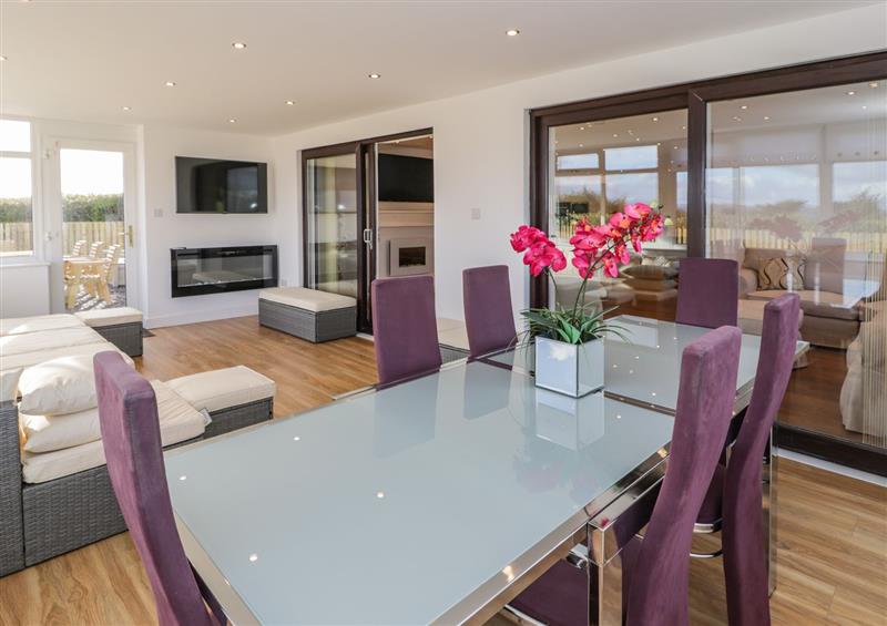 Dining room at Top Of The Lane Holiday Apartment, Benllech