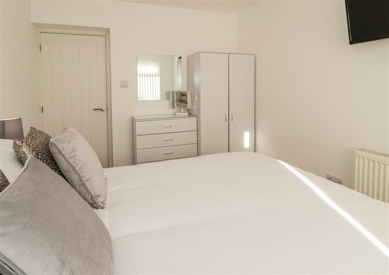 One of the 4 bedrooms (photo 2) at Top Of The Lane Holiday Apartment, Benllech