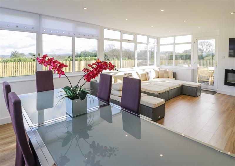 Relax in the living area at Top Of The Lane Holiday Apartment, Benllech