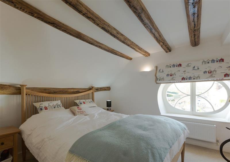 A bedroom in Topcliff Cottage at Topcliff Cottage, Shaldon