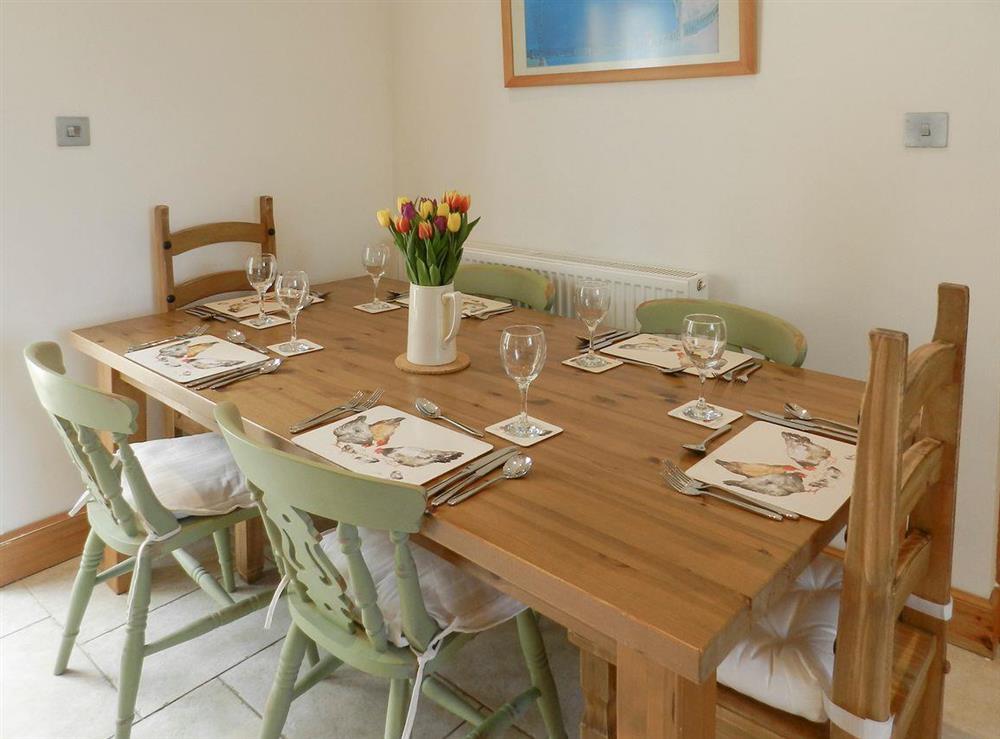 Convenient dining area within kitchen at Torbeg Farm Cottage in Torbeg, near Blackwaterfoot, Isle of Arran, Scotland