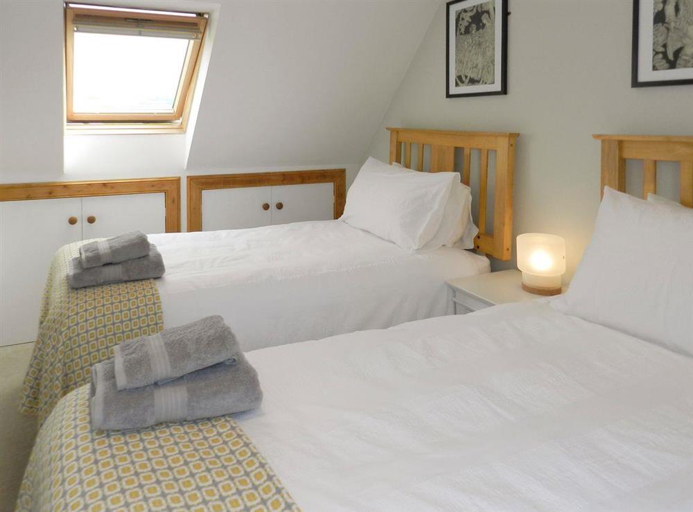 Good sized twin bedroom at Torbeg Farm Cottage in Torbeg, near Blackwaterfoot, Isle of Arran, Scotland