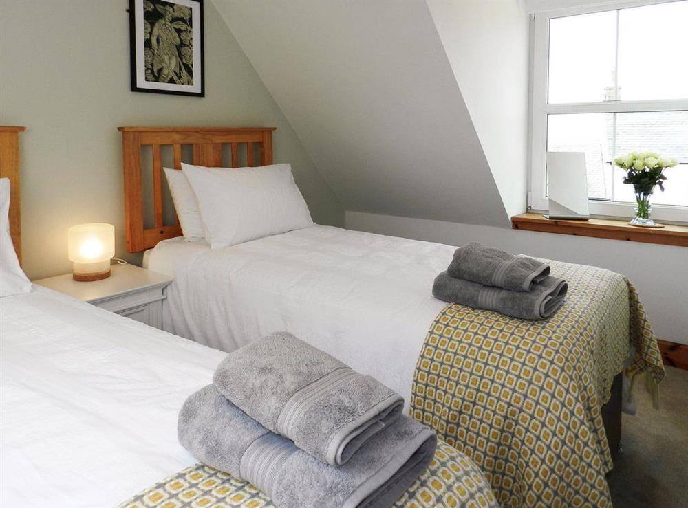 Light and airy twin bedroom at Torbeg Farm Cottage in Torbeg, near Blackwaterfoot, Isle of Arran, Scotland
