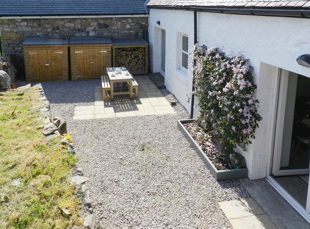 Rear patio and courtyard at Torbeg Farm Cottage in Torbeg, near Blackwaterfoot, Isle of Arran, Scotland