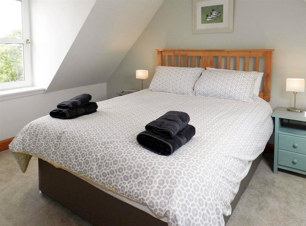 Relaxing double bedroom at Torbeg Farm Cottage in Torbeg, near Blackwaterfoot, Isle of Arran, Scotland