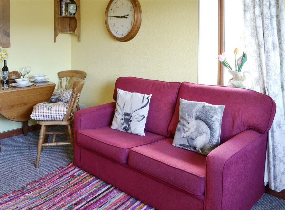 Comfortable seating and convenient dining areas at Thistledown Cottage, 