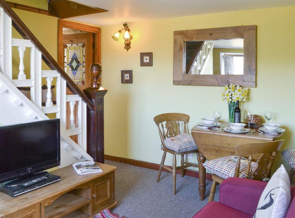 Delightful living and dining room at Thistledown Cottage, 