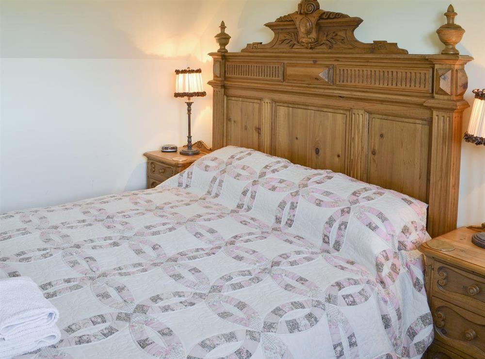 Relaxing double bedroom at Thistledown Cottage, 