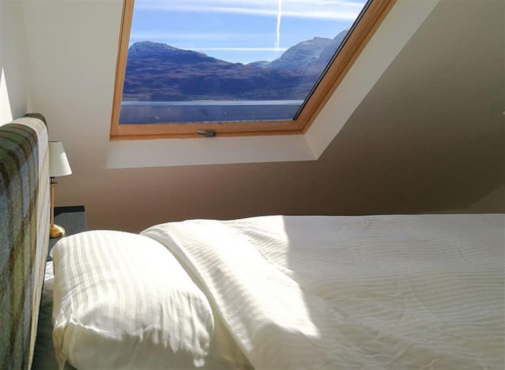 Double bedroom with stunning views (photo 2) at Lochside Cottage, 