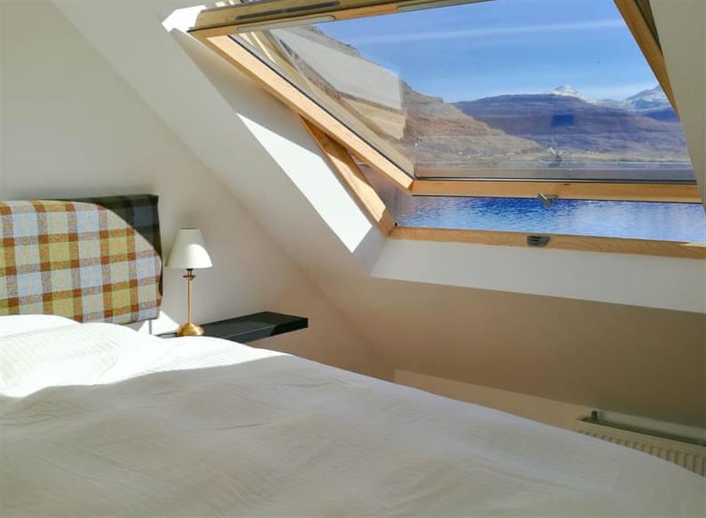 Double bedroom with stunning views at Lochside Cottage, 
