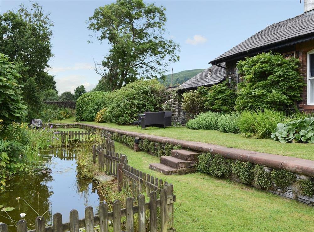 Beautifully manicured garden with wildlife pond at Station Masters House, 