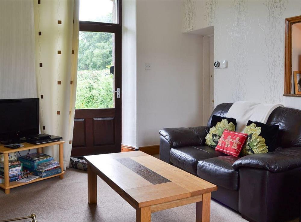 Comfortable living area with direct access to the garden at Ticket Office, 