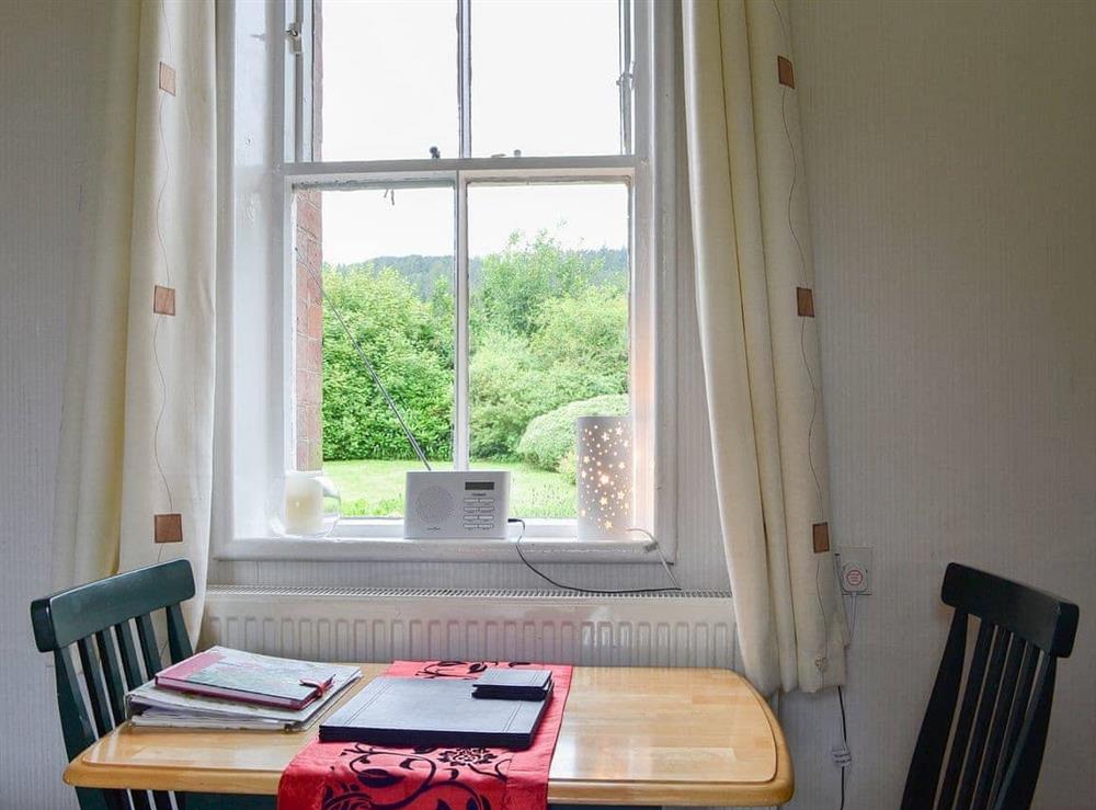 Compact dining area with wonderful view over the garden to the fells beyond at Ticket Office, 