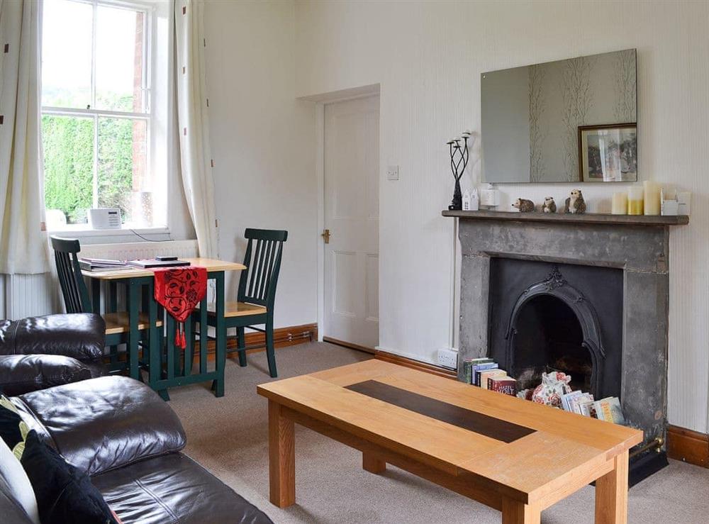 Delightful living/dining room with feature fireplace at Ticket Office, 