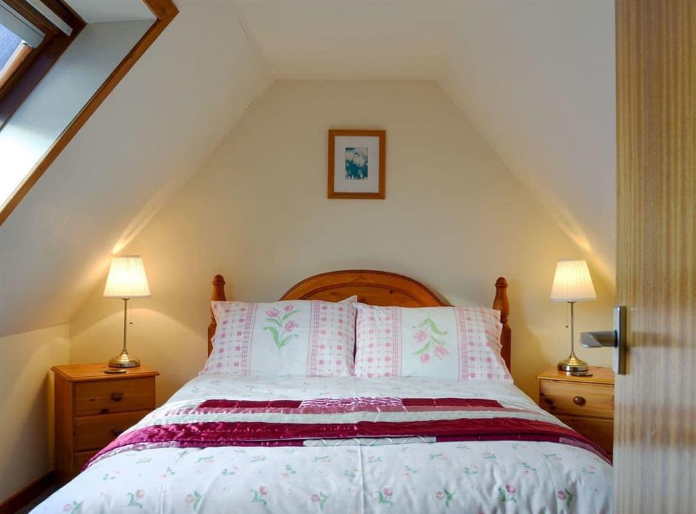 Comfortable double bedroom at Tote Cottage in Skeabost Bridge, Isle Of Skye