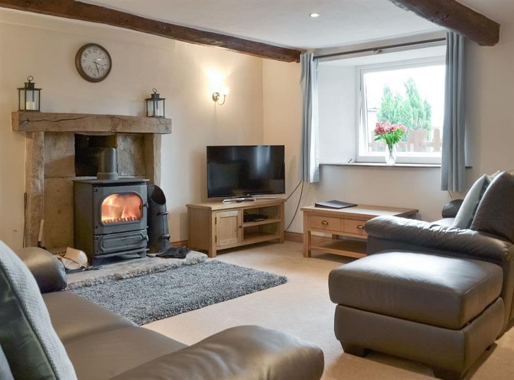 Spacious living room with exposed beams at Townend Cottage in Soulby, near Kirkby Stephen, Cumbria