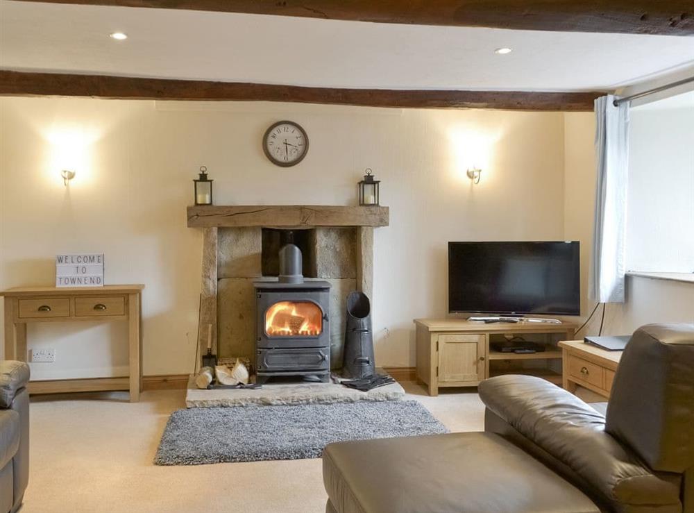 Welcoming living area with wood burner at Townend Cottage in Soulby, near Kirkby Stephen, Cumbria