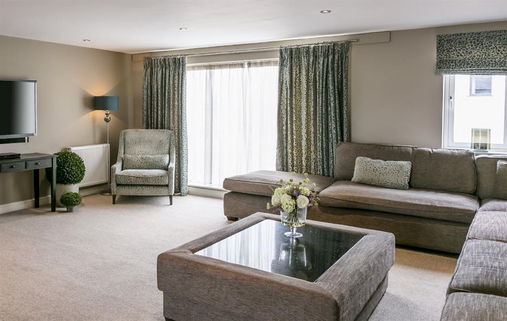 First floor: Open plan large living room with L-shaped sofa at Townhouse No. 6, Burneside, near Kendal