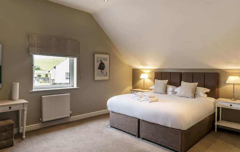 Second floor: Bedroom with 6ft super king bed that can be configured as twin beds on request at Townhouse No. 6, Burneside, near Kendal