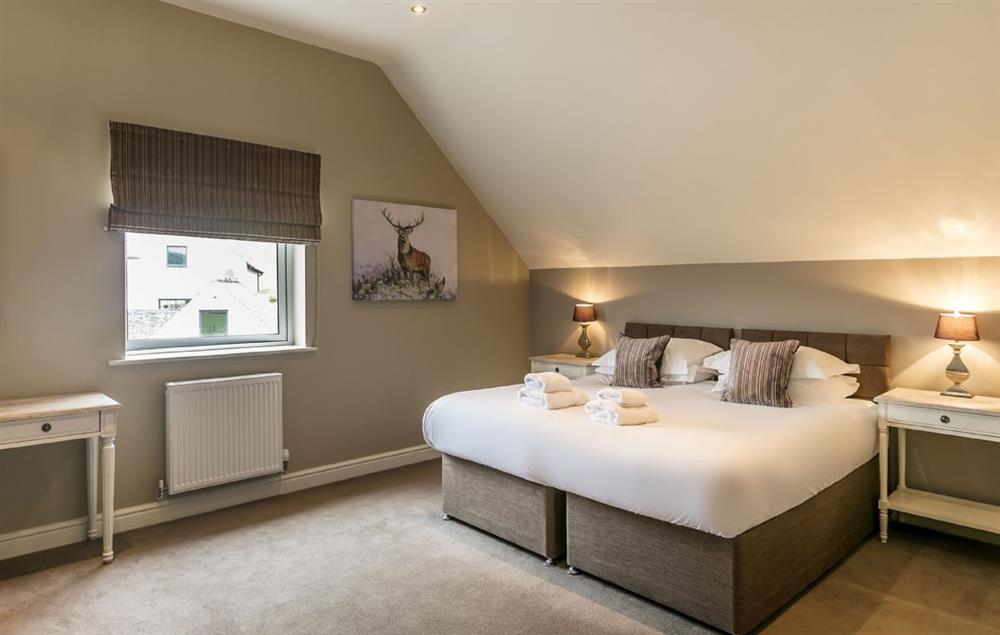 Second floor:  Bedroom with 6ft super king bed that can be configured as twin beds on request at Townhouse No. 7, Burneside, near Kendal