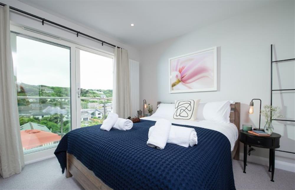 Bedroom one, look out of the Juliet balcony which looks onto the charming village of Portreath at Tralee, Portreath