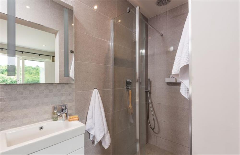 Bedroom one’s en-suite with rainfall shower at Tralee, Portreath