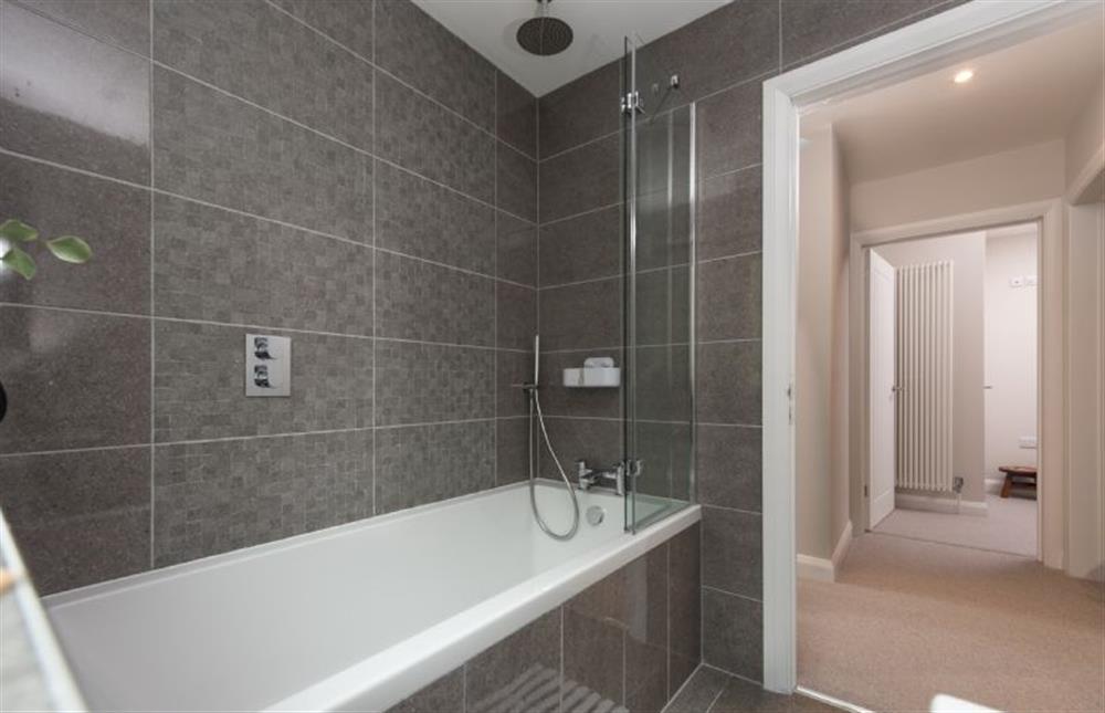 Family bathroom with modern bath and overhead rainfall shower at Tralee, Portreath