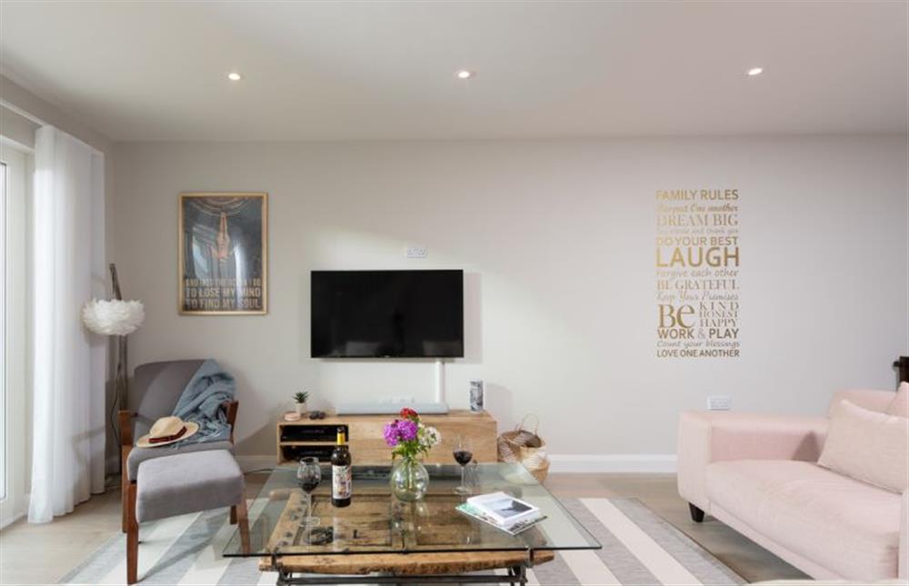 The airy open-plan living area has modern decor throughout at Tralee, Portreath